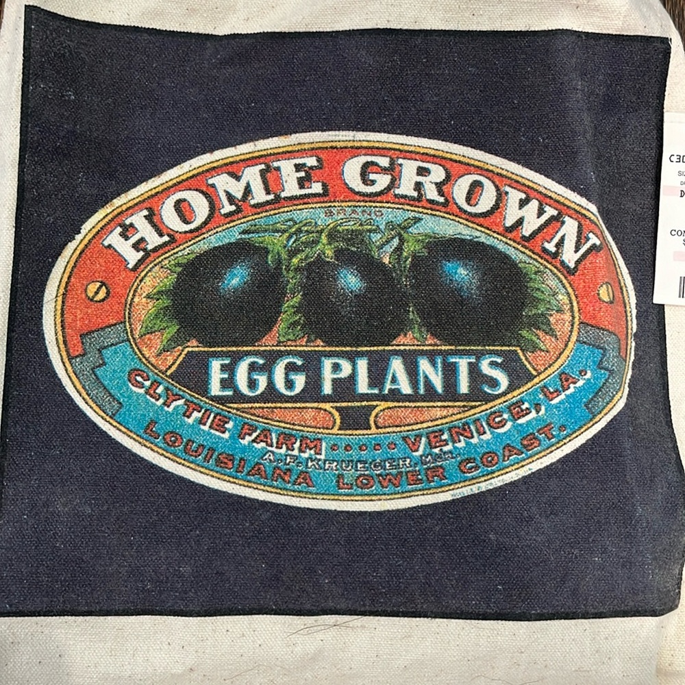Heartland trading company with tags, eggplant apron